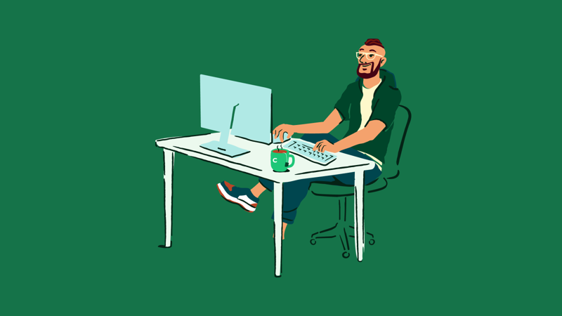 a person sitting at a desk with a computer